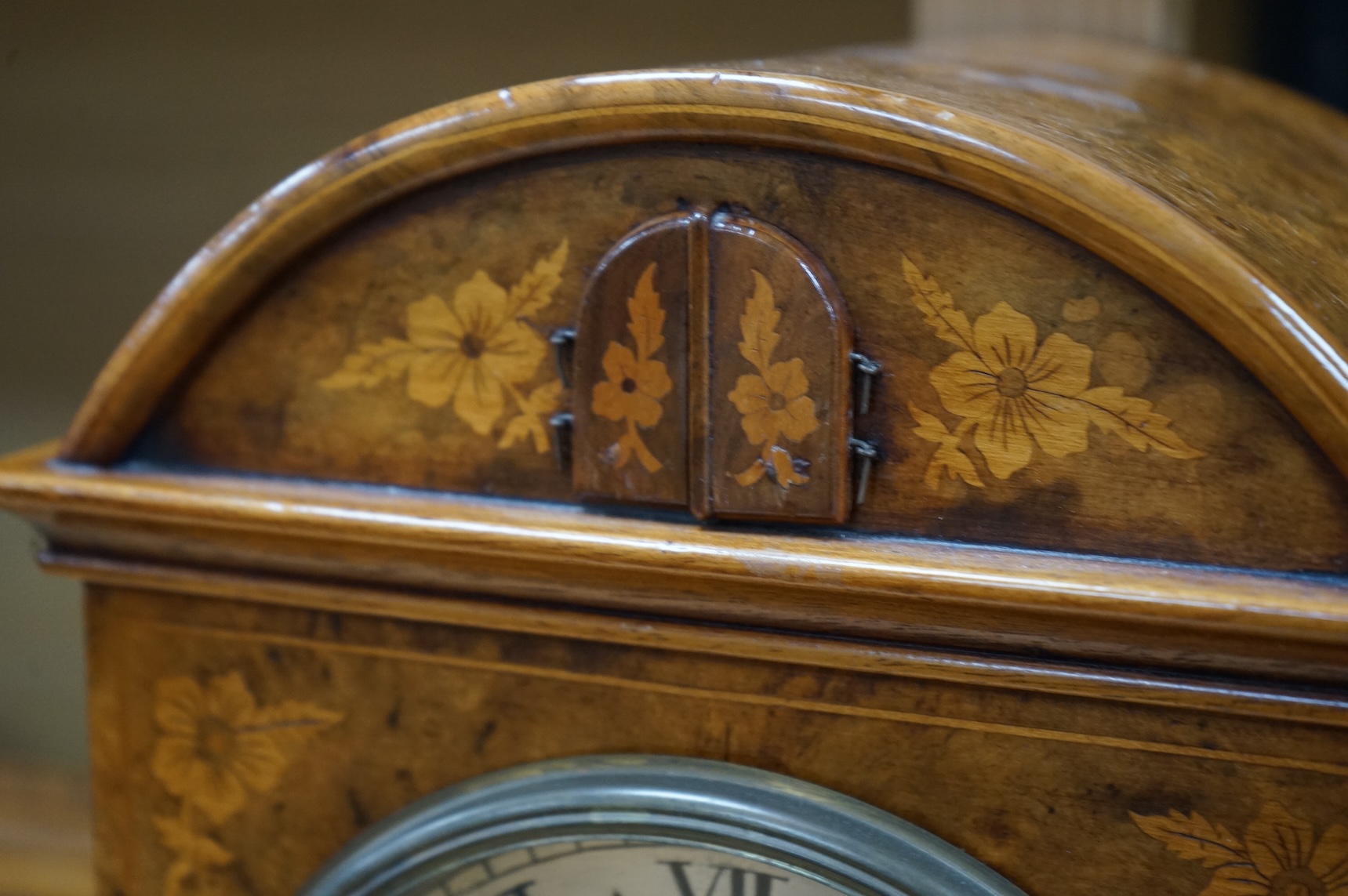 A Victorian burr walnut and marquetry dome topped cuckoo clock, signed Mitchell, London, with oak bracket, 41cm high